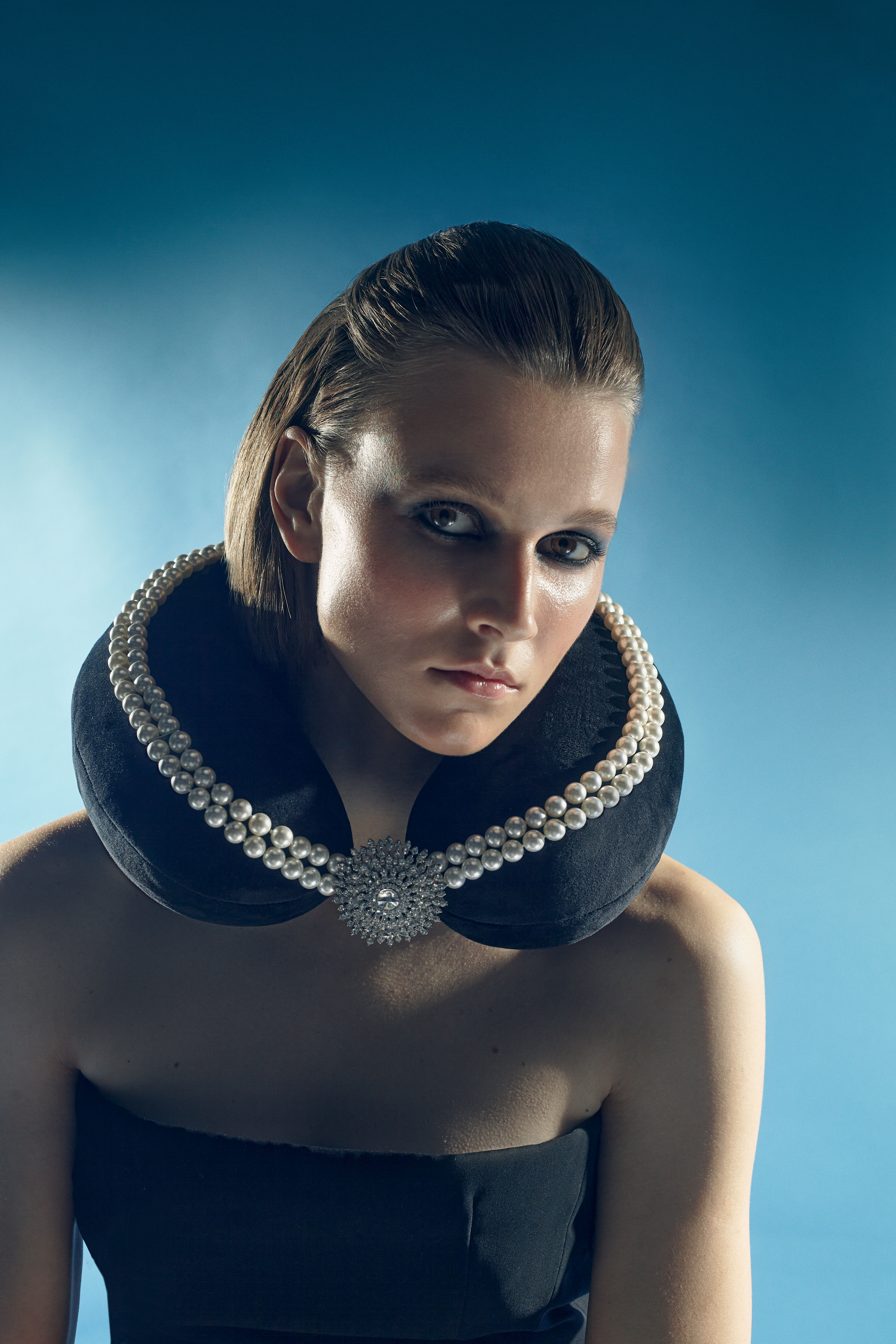 Editorial fashion portrait with sculptural styling and minimal composition