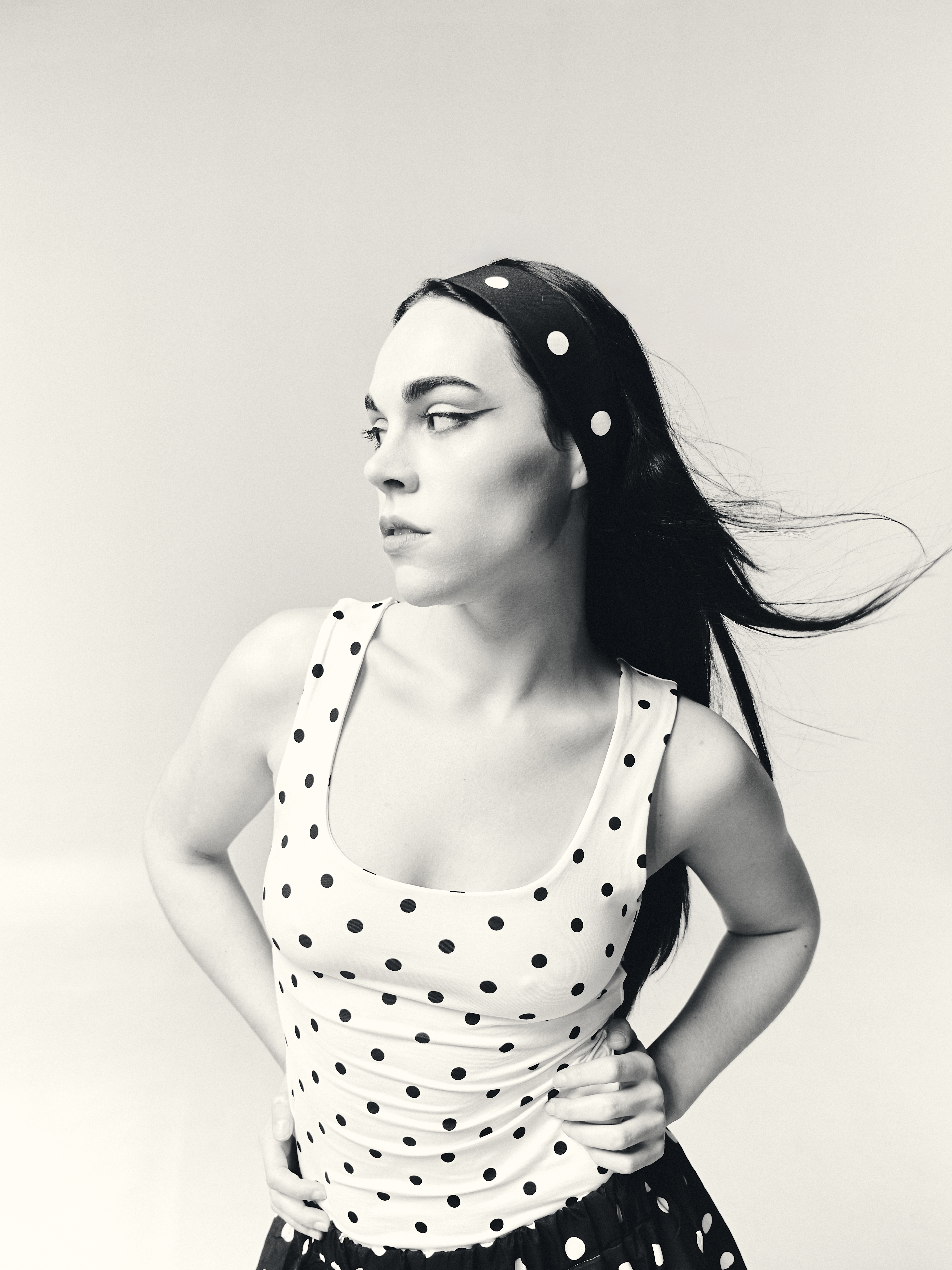 Contemporary black and white editorial portrait with sophisticated aesthetic